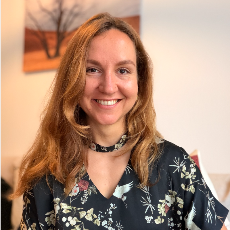 Sasha Lukavchenko smiling, wearing a floral shirt.